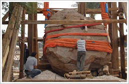 Workers re-erecting the stele of Amenhotep III